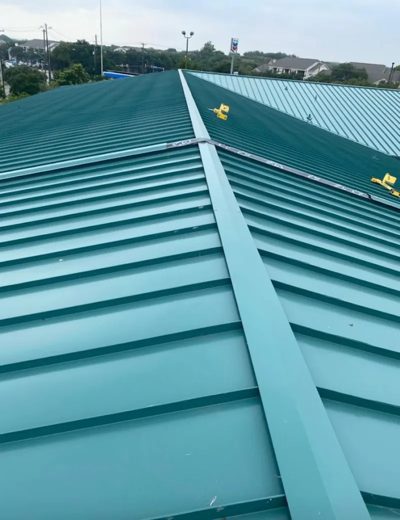 Green commercial metal roof ridge and valley for Metal Roof Repair in Riverdale Park
