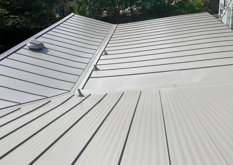 Solar attic fan installed on a metal roof for Roof Ventilation in Riverdale Park